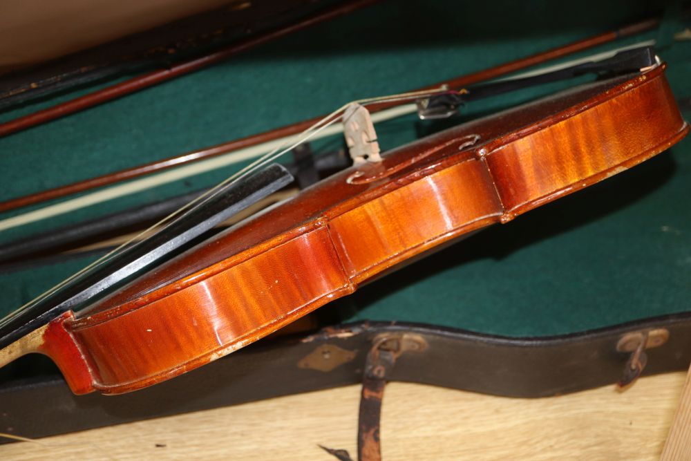 A 20th century Antonius Stradivarius Cremonensis violin, cased with two bows